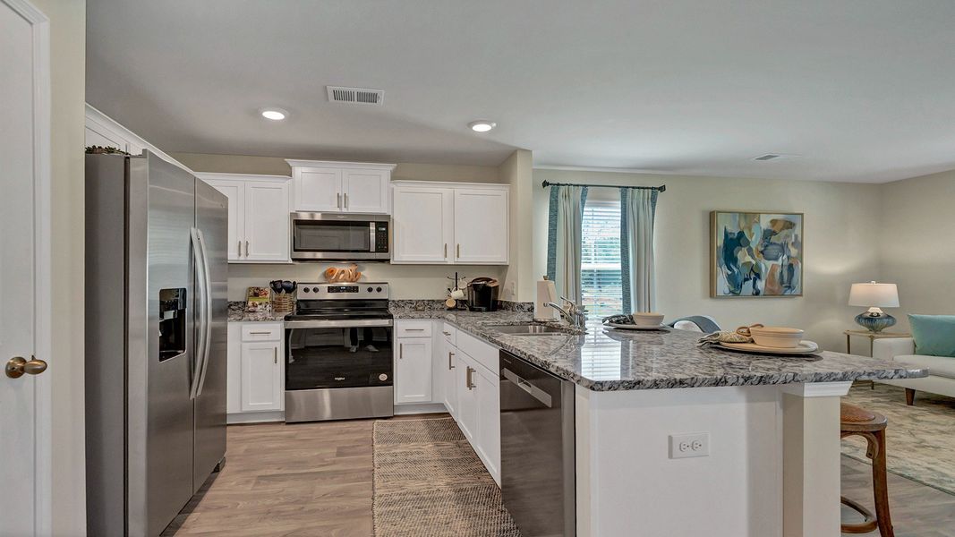Representative furnished interior of a home built from the Pearson Th by D.R. Horton in Hunter's Branch Townhomes, Hopkins (Image 7).