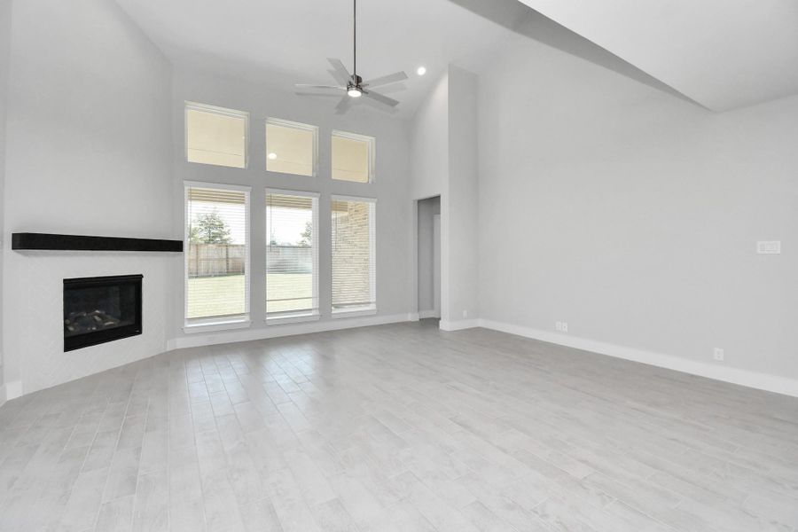 Take another glimpse into the heart of the home with this additional view of the family room—a sprawling space ready to accommodate all your gatherings. Sample photo of completed home with similar floor plan. Actual colors and selections may vary. Take another glimpse into the heart of the home with this additional view of the family room—a sprawling space ready to accommodate all your gatherings. Sample photo of completed home with similar floor plan. Actual colors and selections may vary.