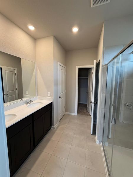 Primary Bath with dual vanities and walk-in shower Primary Bath with dual vanities and walk-in shower