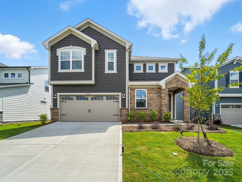 Front exterior of a new home in Waxhaw Landing, Monroe, NC, highlighting curb appeal (Image 16).