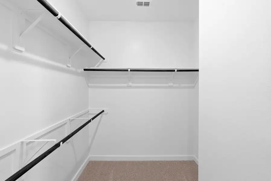 Large walk-in closet providing abundant storage