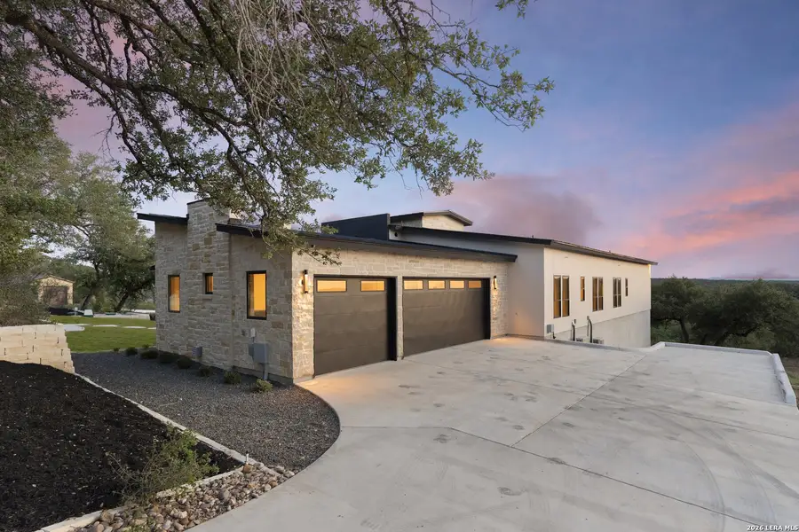 Front exterior of a new home in , Canyon Lake, TX, highlighting curb appeal (Image 31).