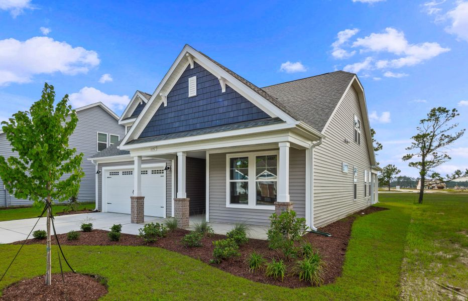 Front exterior of a new home in Coastal Club of the Carolinas, Calabash, NC, highlighting curb appeal (Image 14).