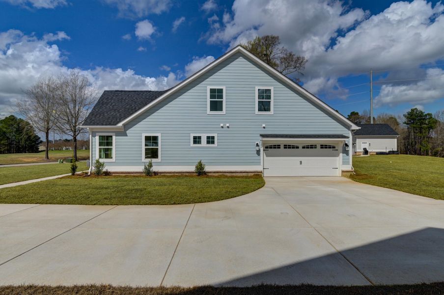 Front exterior of a new home in Clubside Reserve at Summerlake, Lexington, SC, highlighting curb appeal (Image 28).