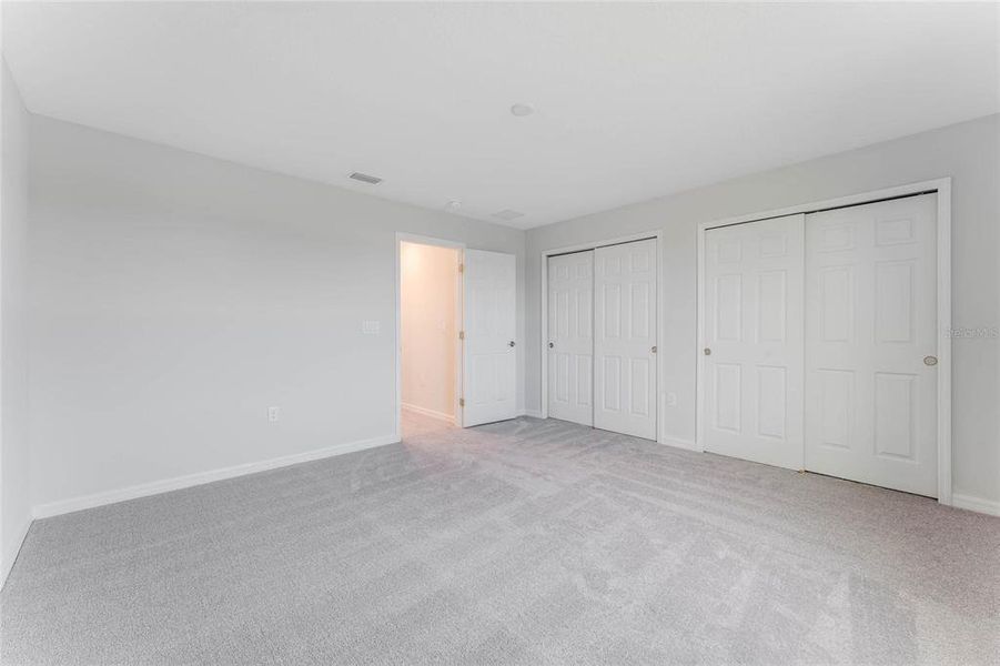 Spacious, unfurnished interior of a new home in Covered Bridge at Liberty Bluff, Haines City (Image 24).