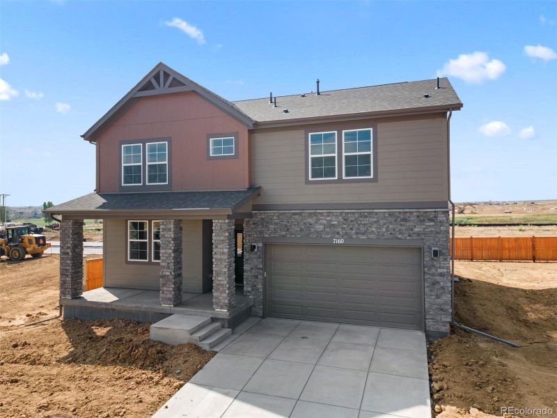 Front exterior of a new home in , Brighton, CO, highlighting curb appeal (Image 21).