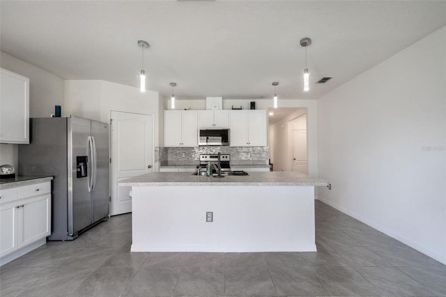 Furnished interior view inside a new home in Poinciana Enclave, Kissimmee (Image 9).