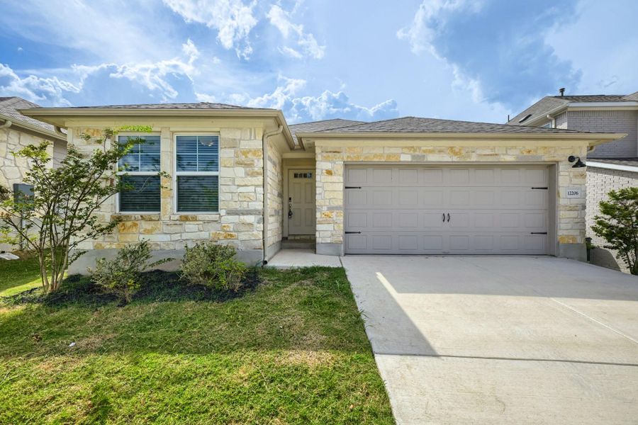 Front exterior of a new home in , Buda, TX, highlighting curb appeal (Image 18). Front exterior of a new home in , Buda, TX, highlighting curb appeal (Image 18).