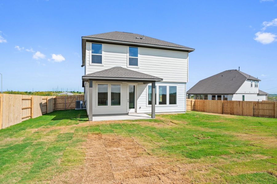 Exterior details and patio area of a home in Terrace Collection At Turner's Crossing, Buda (Image 27).