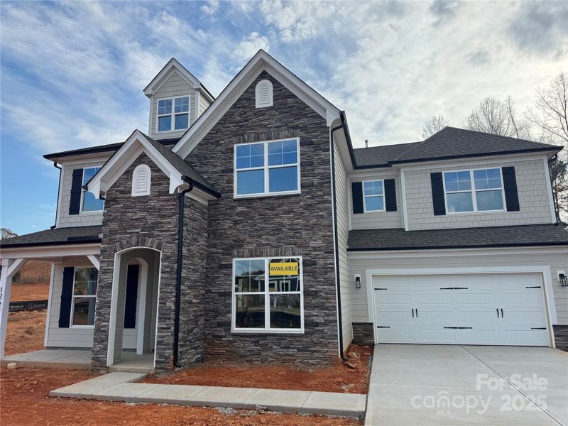Front exterior of a new home in Carrington, Stanley, NC, highlighting curb appeal (Image 2).