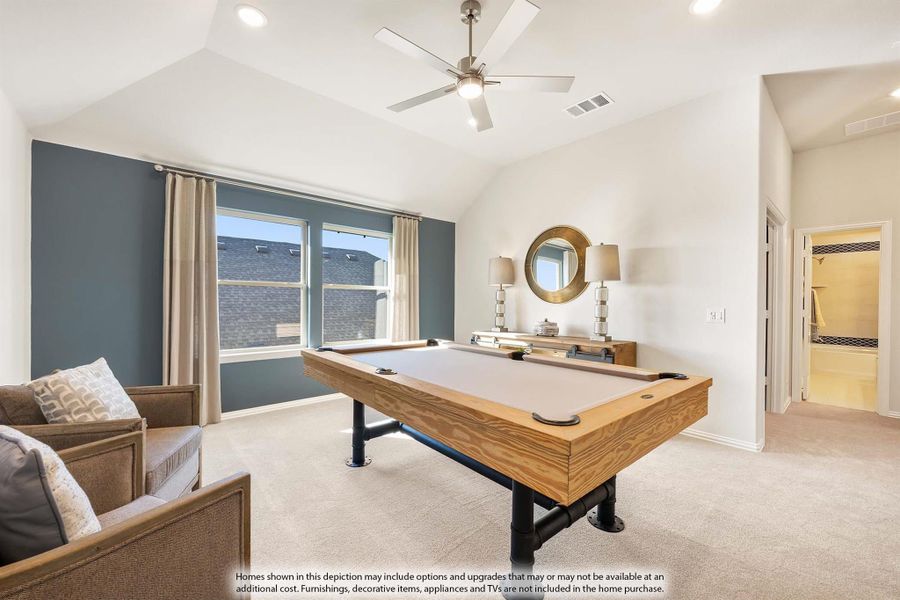 Game room with wood pool table, vaulted ceiling, ceiling fan, and blue accent wall
