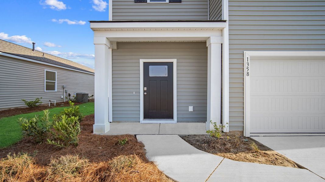 Exterior details and patio area of a home in The Retreat at East Argent, Ridgeland (Image 2).
