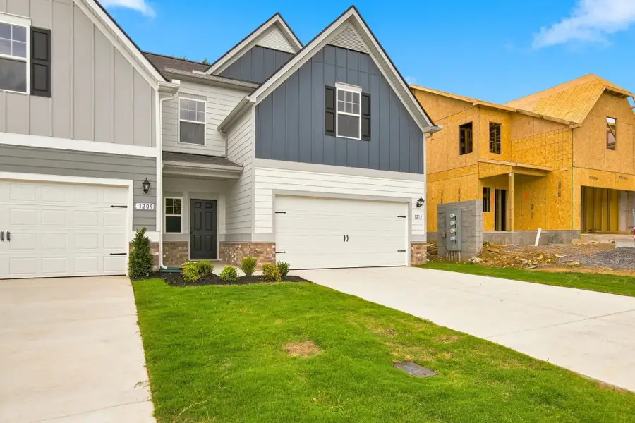 Front exterior of a new home in Spring Branch, Smyrna, TN, highlighting curb appeal (Image 23).