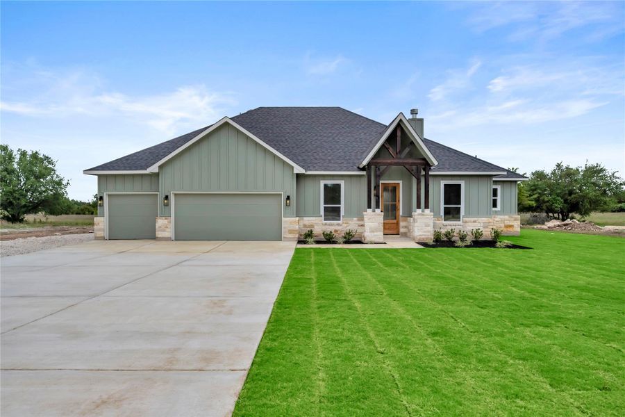 Front exterior of a new home in , Bertram, TX, highlighting curb appeal (Image 22).