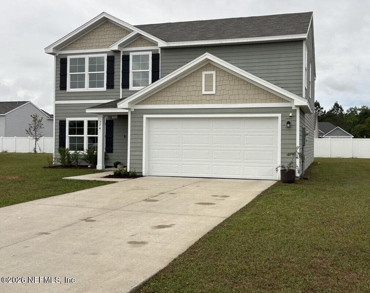 Front exterior of a new home in , Macclenny, FL, highlighting curb appeal (Image 15). Front exterior of a new home in , Macclenny, FL, highlighting curb appeal (Image 15).