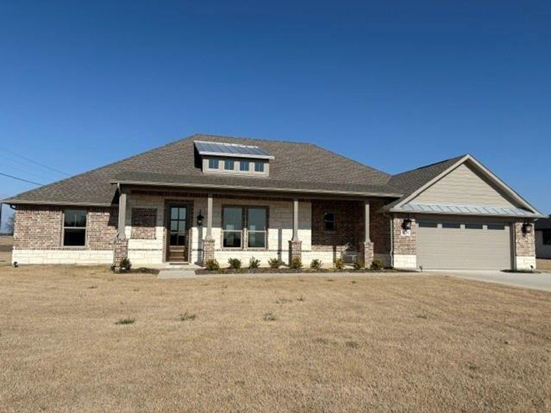 Front exterior of a new home in , Van Alstyne, TX, highlighting curb appeal (Image 26).