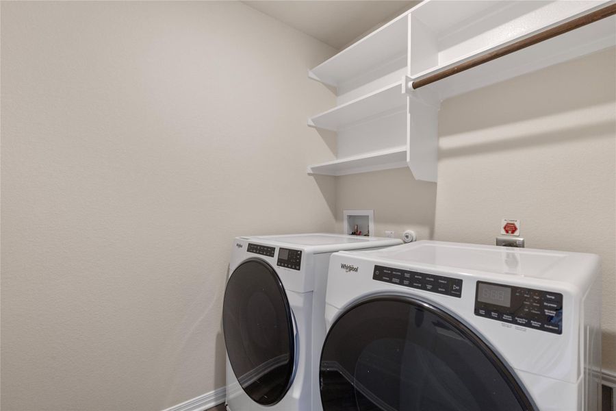 Laundry room featuring included washer and dryer Laundry room featuring included washer and dryer