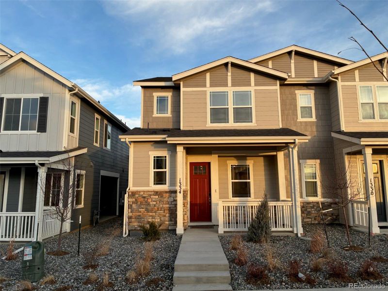 Front exterior of a new home in Urban Collection at Parkdale, Erie, CO, highlighting curb appeal (Image 1). Front exterior of a new home in Urban Collection at Parkdale, Erie, CO, highlighting curb appeal (Image 1).