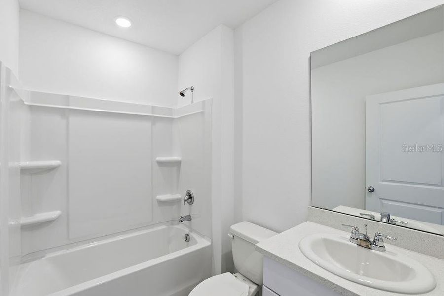 Furnished interior view inside a new home in Waterstone, Groveland (Image 29).