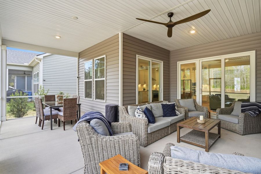 Exterior details and patio area of a home in Summerwind Crossing at Lakes of Cane Bay, Summerville (Image 3).