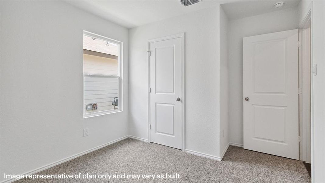 Unfurnished bedroom featuring carpet flooring and baseboards