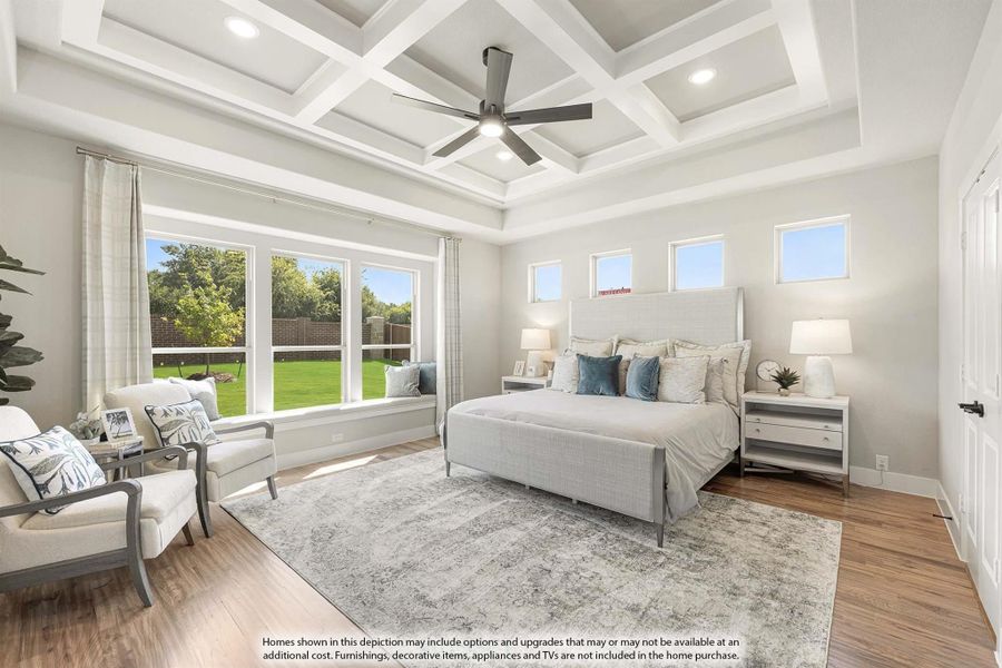 Master bedroom with coffered ceiling, ceiling fan, hardwood floors, and large windows overlooking a backyard.