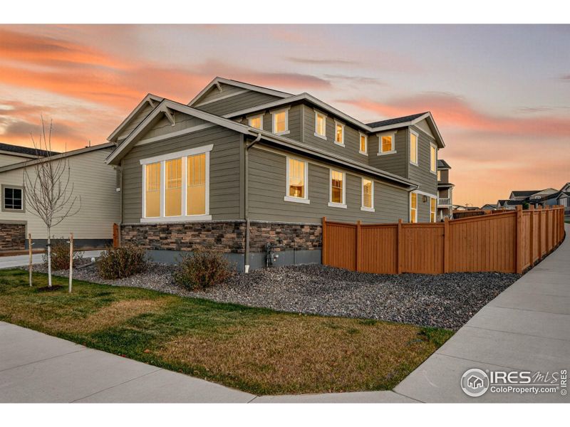 Twilight exterior angle highlighting the home's curb appeal and welcoming exterior.