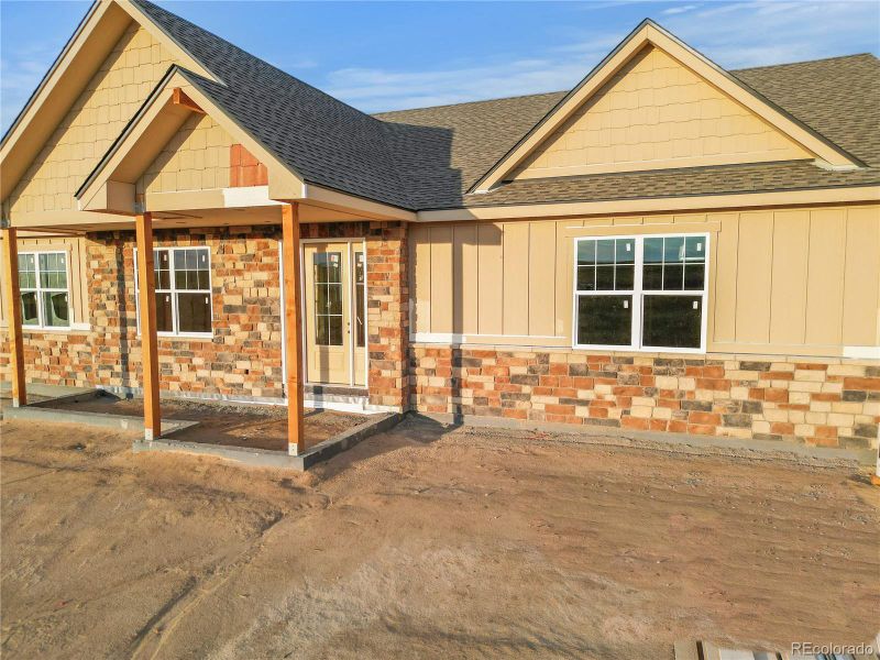 Front exterior of a new home in , Kiowa, CO, highlighting curb appeal (Image 16).