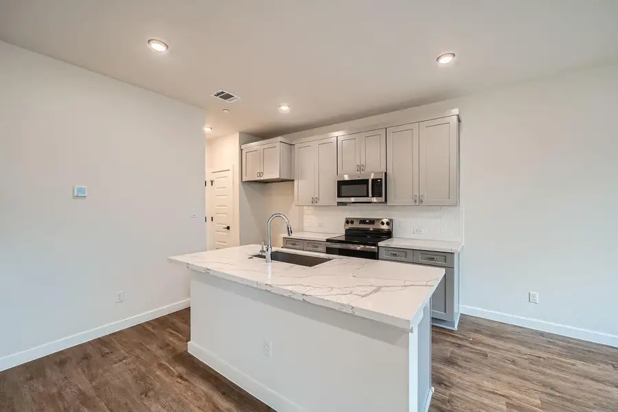 Furnished interior view inside a new home in Townhomes at Gattis, Round Rock (Image 9).