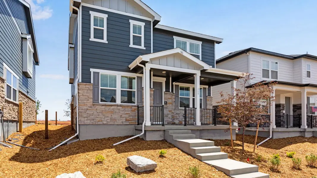 Exterior details and patio area of a home in Horizon Uptown, Aurora (Image 2). Exterior details and patio area of a home in Horizon Uptown, Aurora (Image 2).