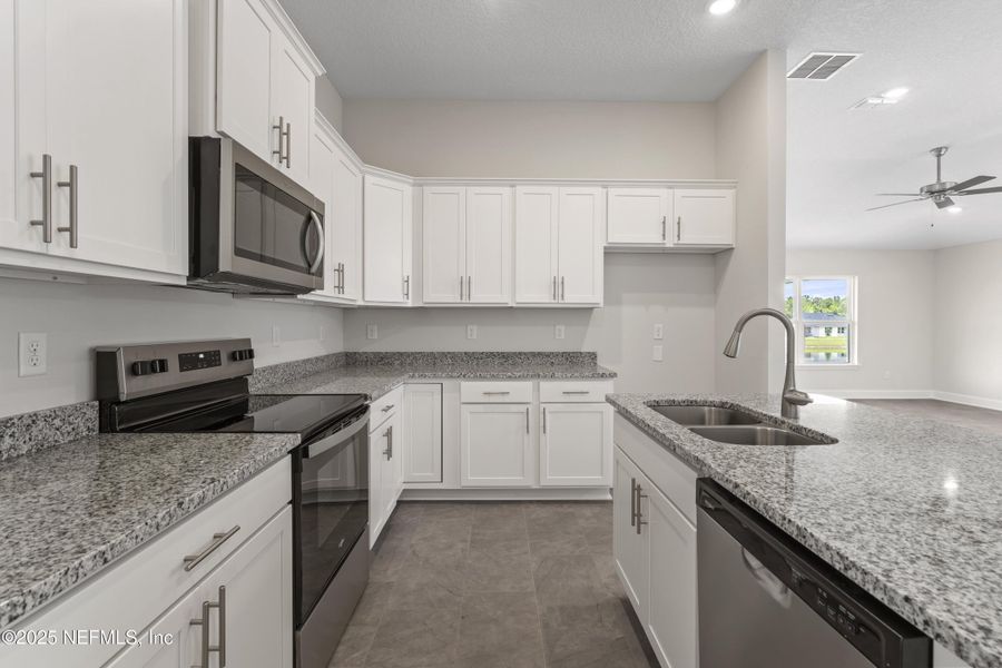 Furnished interior view inside a new home in Shadow Crest at Rolling Hills, Green Cove Springs (Image 9). Furnished interior view inside a new home in Shadow Crest at Rolling Hills, Green Cove Springs (Image 9).