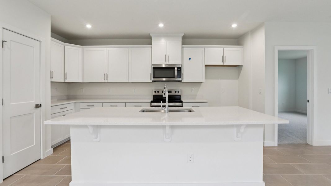 Naples Kitchen with Bright cabinets and large Island at Grasslands West in Lakeland FL