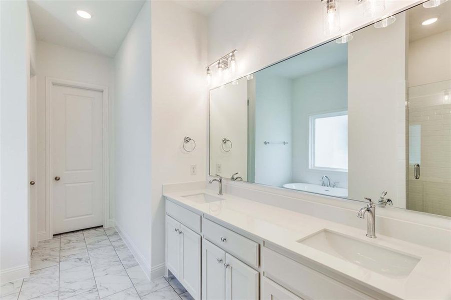 Bathroom featuring vanity and plus walk in shower