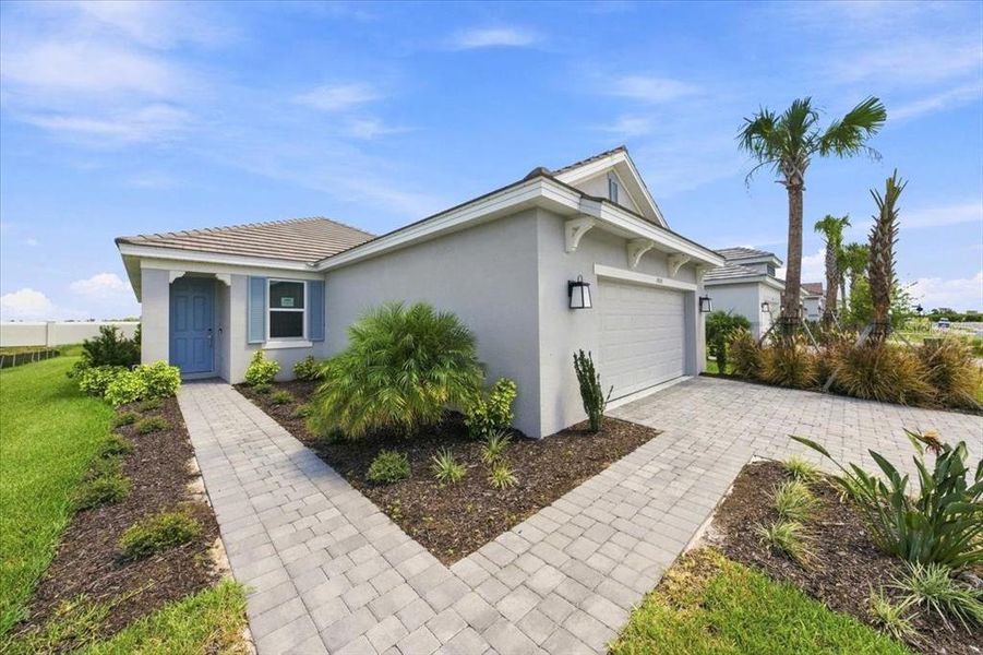 Front exterior of a new home in Coasterra Community Group Page, Palmetto, FL, highlighting curb appeal (Image 25).