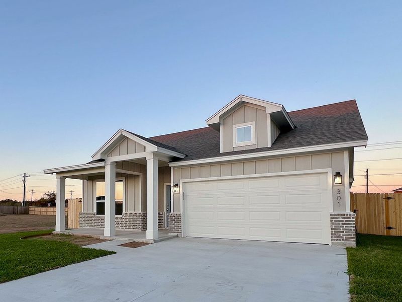 Front exterior of a new home in TerraVista, Victoria, TX, highlighting curb appeal (Image 26). Front exterior of a new home in TerraVista, Victoria, TX, highlighting curb appeal (Image 26).