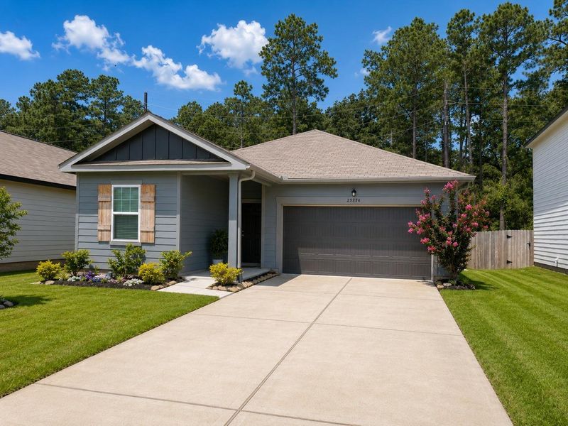 Front exterior of a new home in Spring Creek Trails, Magnolia, TX, highlighting curb appeal (Image 2). Front exterior of a new home in Spring Creek Trails, Magnolia, TX, highlighting curb appeal (Image 2).
