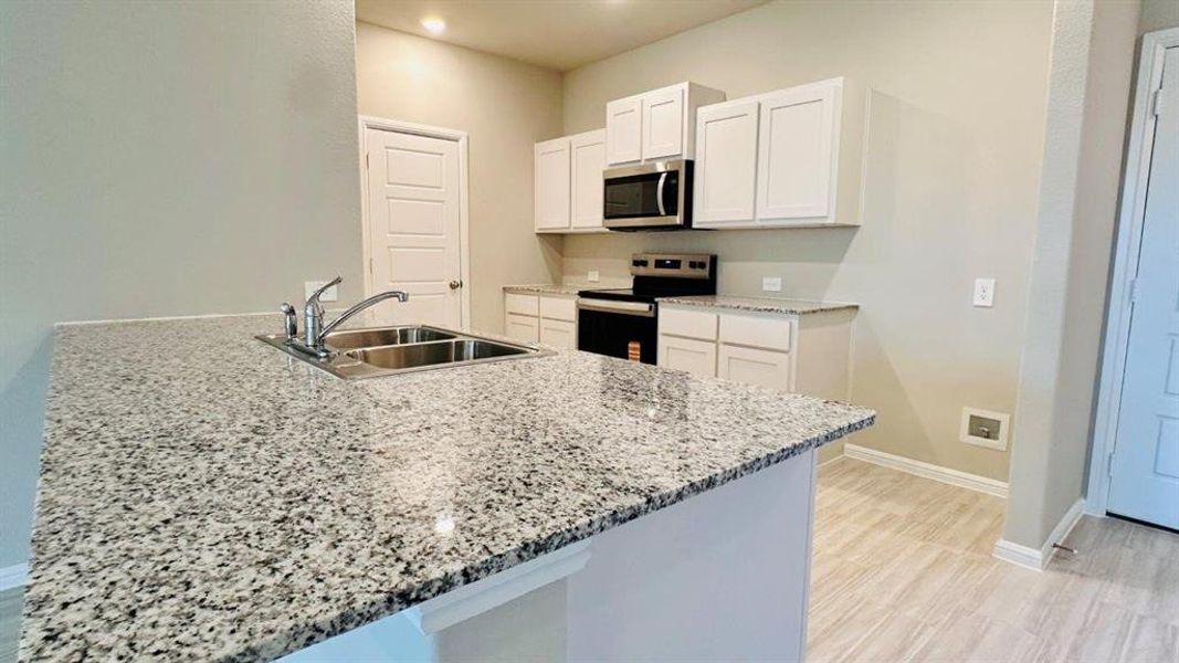 Kitchen - All Home and community information, including pricing, included features, terms, availability and amenities, are subject to change at any time without notice or obligation. All Drawings, pictures, photographs, video, square footages, floor plans, elevations, features, colors and sizes are approximate for illustration purposes only and will vary from the homes as built.