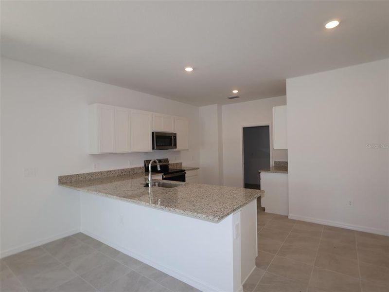 Furnished interior view inside a new home in Southpointe, Palmetto (Image 2). Furnished interior view inside a new home in Southpointe, Palmetto (Image 2).