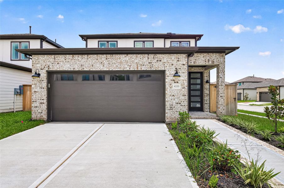 Front exterior of a new home in , Stafford, TX, highlighting curb appeal (Image 26). Front exterior of a new home in , Stafford, TX, highlighting curb appeal (Image 26).