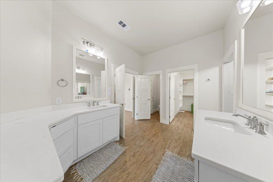 Bathroom with vanity and wood finished floors Bathroom with vanity and wood finished floors