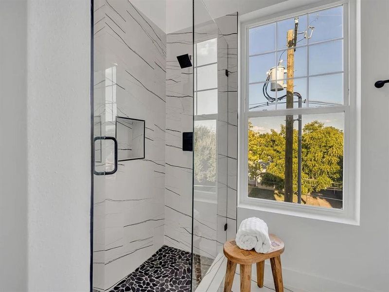 Bathroom featuring a marble finish shower