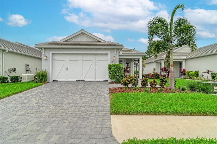 Front exterior of a new home in , Sarasota, FL, highlighting curb appeal (Image 27).