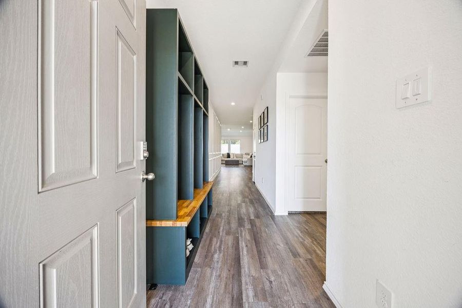 Welcome to a bright, inviting entrance featuring sleek flooring and ample storage, leading seamlessly into your spacious living area. Welcome to a bright, inviting entrance featuring sleek flooring and ample storage, leading seamlessly into your spacious living area.