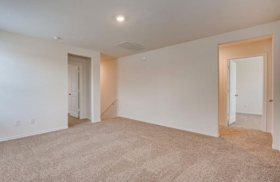 Carpeted interior space featuring white walls and ceiling Carpeted interior space featuring white walls and ceiling