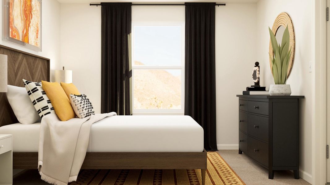 A bedroom with a bed and a dresser.