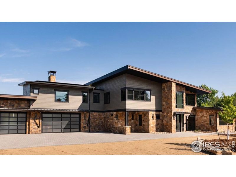 Front exterior of a new home in , Longmont, CO, highlighting curb appeal (Image 2).