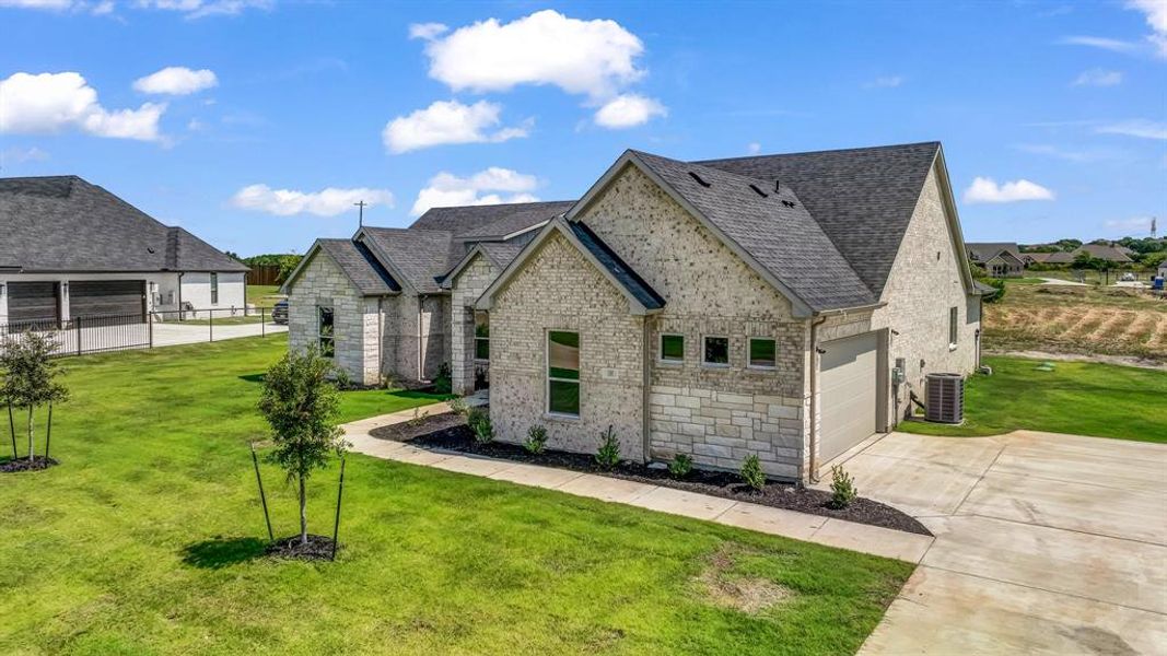 Front exterior of a new home in , Weatherford, TX, highlighting curb appeal (Image 19). Front exterior of a new home in , Weatherford, TX, highlighting curb appeal (Image 19).
