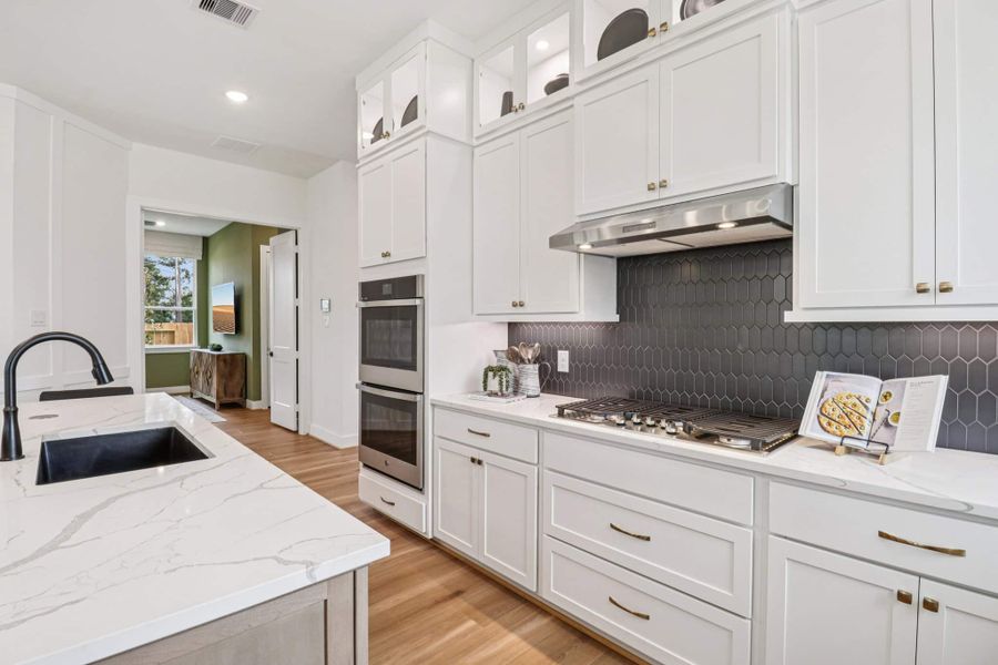 Representative furnished interior of a home built from the Lauren by Chesmar Homes in Grange, Katy (Image 9).