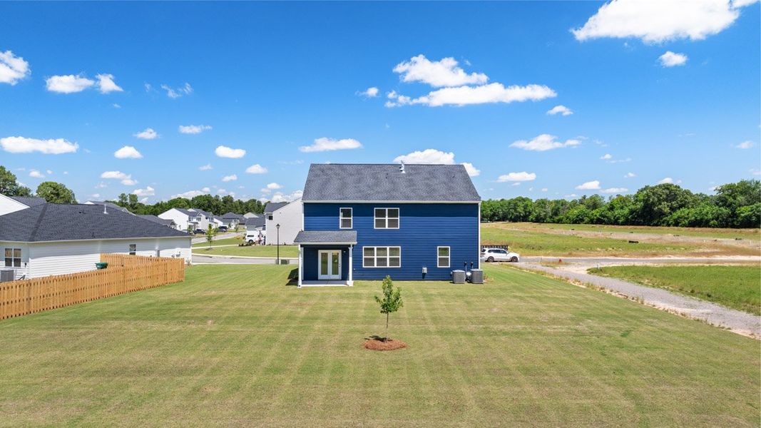 Front exterior of a new home in Southwind Village, Evans, GA, highlighting curb appeal (Image 22).