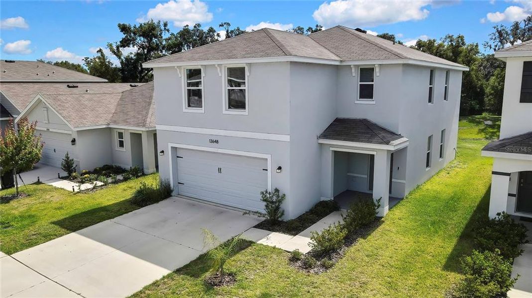 Front exterior of a new home in Heritage Hills, Dade City, FL, highlighting curb appeal (Image 22). Front exterior of a new home in Heritage Hills, Dade City, FL, highlighting curb appeal (Image 22).